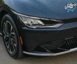 A close-up view of the vehicle's front corner, highlighting the sharp LED headlight assembly.